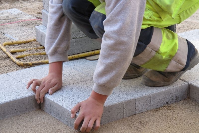 putting on cement rocks concrete paving