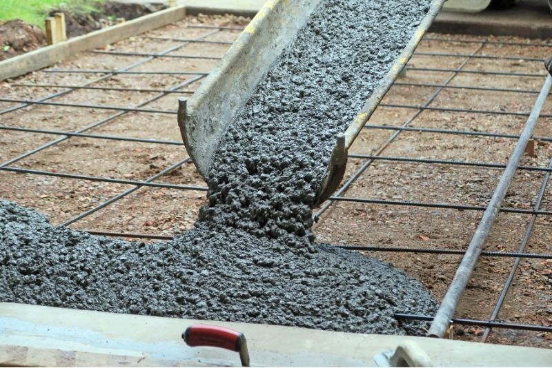 pouring the concrete mix into a pattern