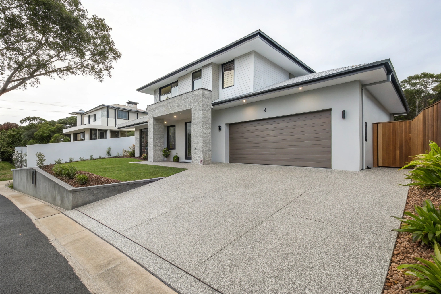 Exposed aggregate concrete driveway Newcastle home